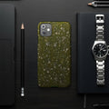 iPhone case with a textured green and white mossy stone pattern.