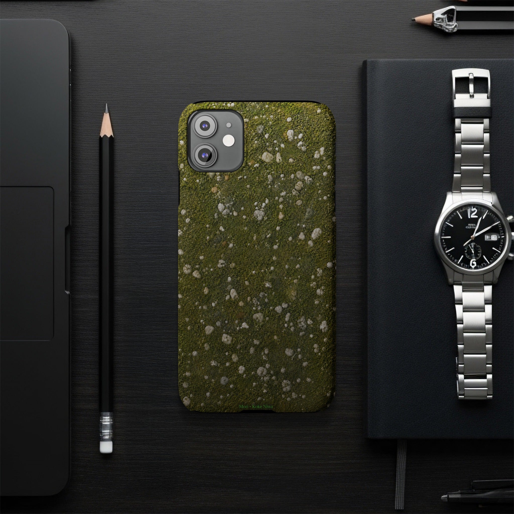 iPhone case with a textured green and white mossy stone pattern.