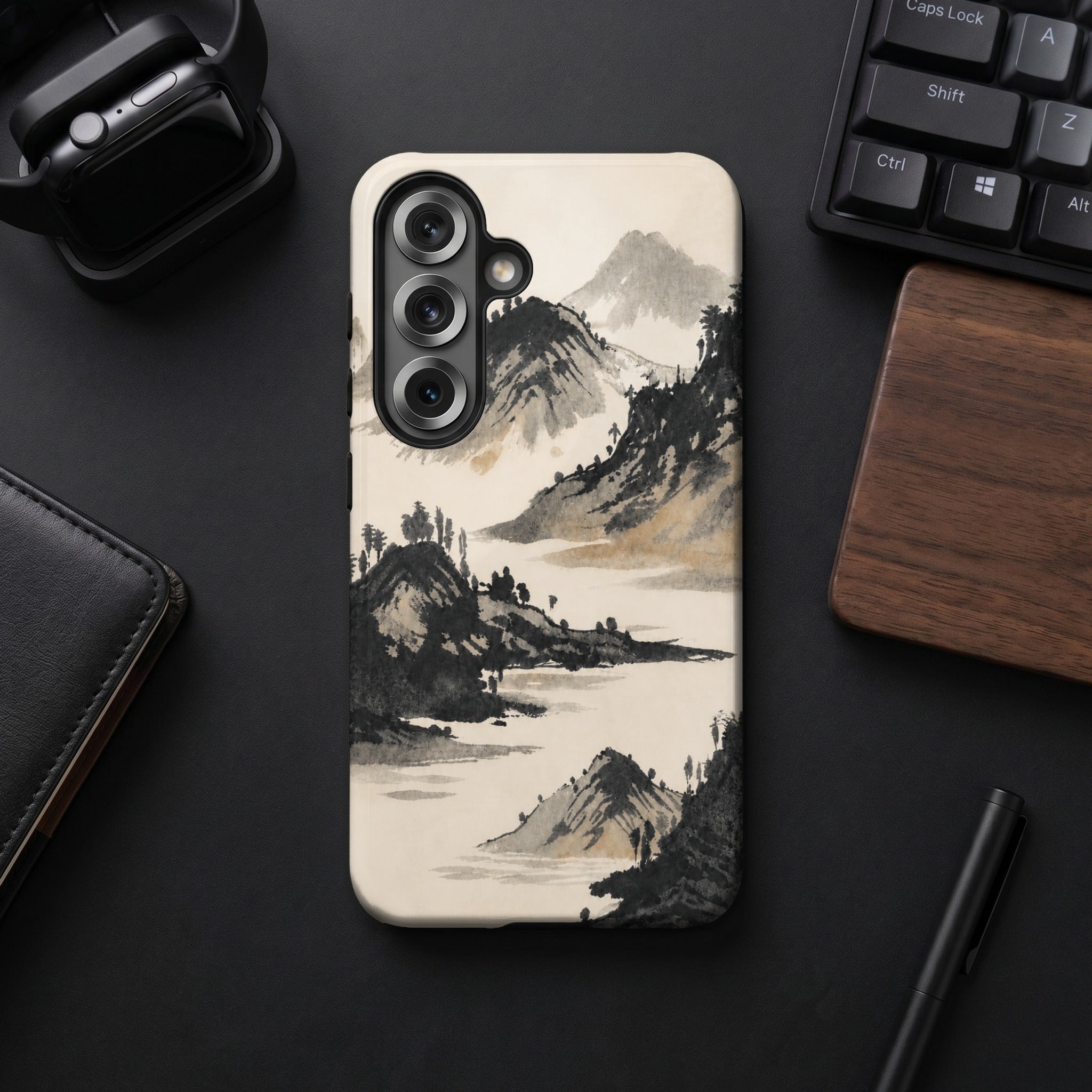 Phone case with traditional ink painting of misty mountains and water.