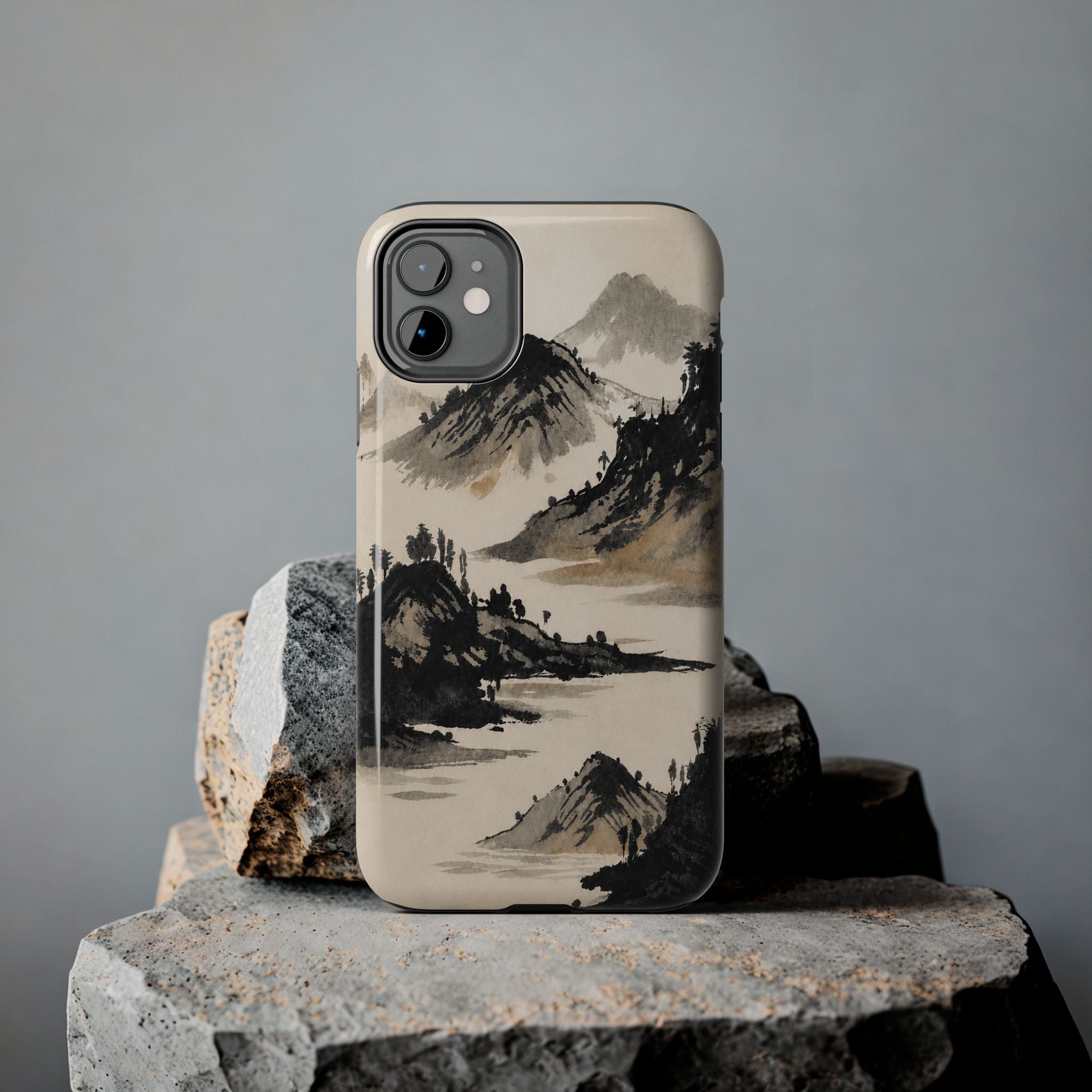 Phone case with Japanese ink painting of mountains and trees.